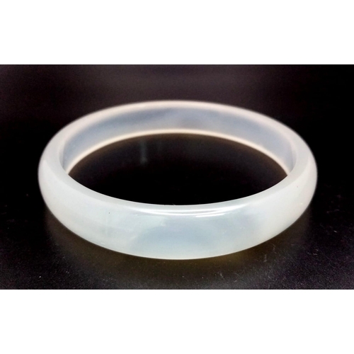 265 - A very attractive pair of semi-translucent, white, Imperial jade bangles in presentation boxes. Inne... 