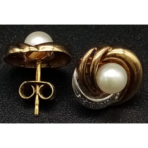 554 - A Pair of 9K Yellow and White Gold Pearl and Diamond Swirl Earrings. 2.67g total weight.