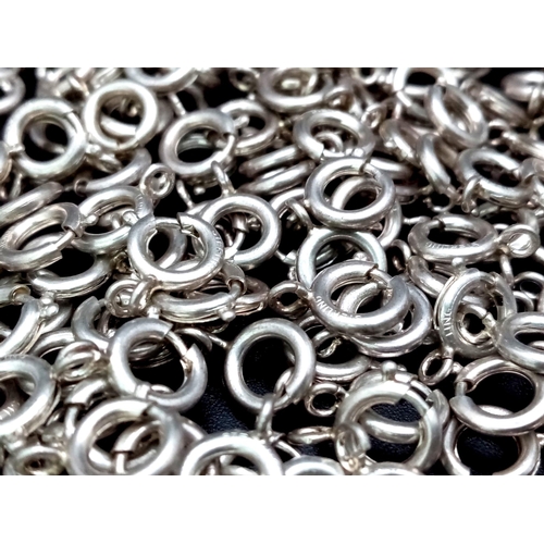 594 - A large group of silver hoop clasps. Total weight: 55 g.