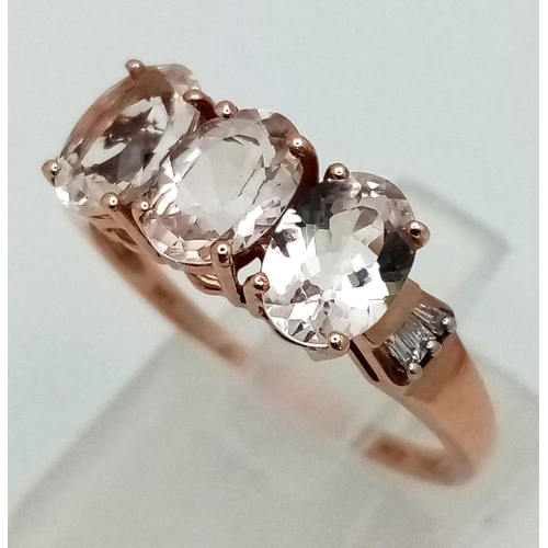 1044 - A 10K Rose Gold Trilogy White Gemstone Ring. Size P 1/2. 2.05g total weight