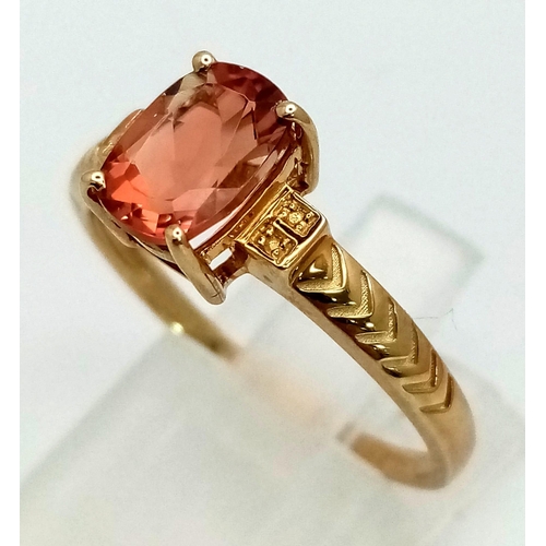 1046 - A 10K Yellow Gold Orange Spinel Solitaire Ring. Size S. 2.18g total weight.