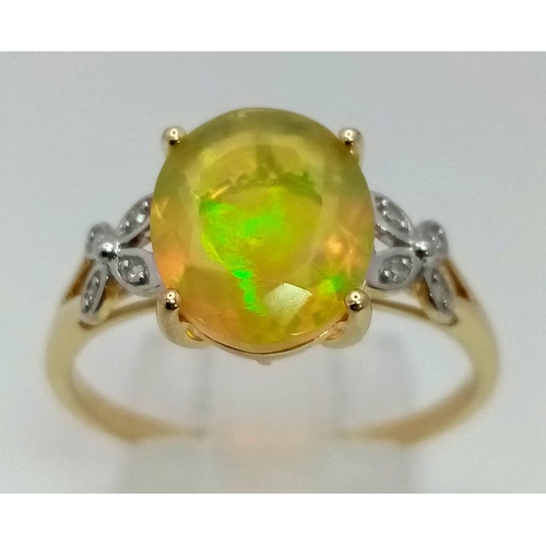 1050 - A 10K Yellow Gold Opal and Diamond Ring. Central oval opal with floral diamond either side. Size R. ... 