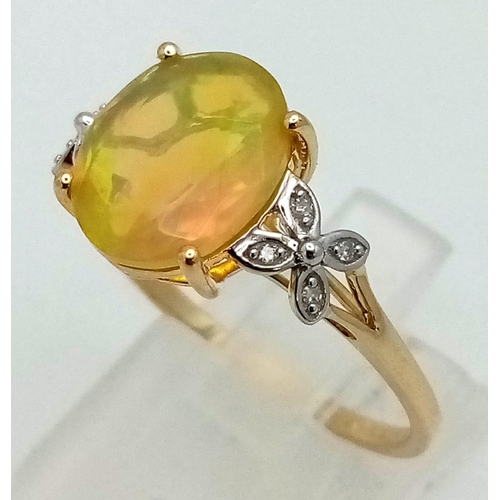 1050 - A 10K Yellow Gold Opal and Diamond Ring. Central oval opal with floral diamond either side. Size R. ... 