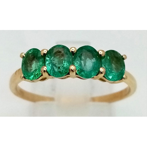 1065 - A 10K Yellow Gold Four Sea-Green Quartz Gemstone Ring. Size R 1/2. Total weight - 1.89g.