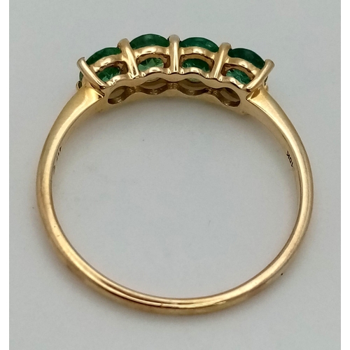 1065 - A 10K Yellow Gold Four Sea-Green Quartz Gemstone Ring. Size R 1/2. Total weight - 1.89g.