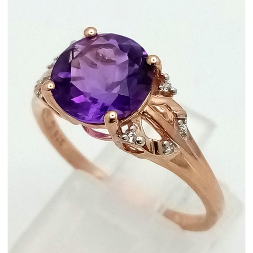 1072 - A 10K Rose Gold Amethyst and Diamond Ring. Lovely round cut, clean amethyst with small diamonds on s... 