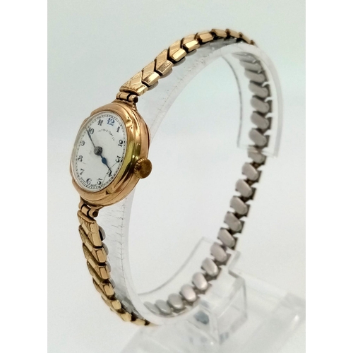 1217 - A Vintage Possibly Antique Johnston and Court Ltd 9K Gold Cased Ladies Watch. Expandable gold plated... 