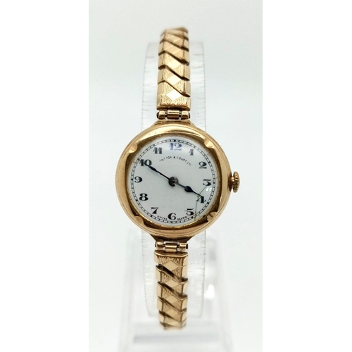 1217 - A Vintage Possibly Antique Johnston and Court Ltd 9K Gold Cased Ladies Watch. Expandable gold plated... 