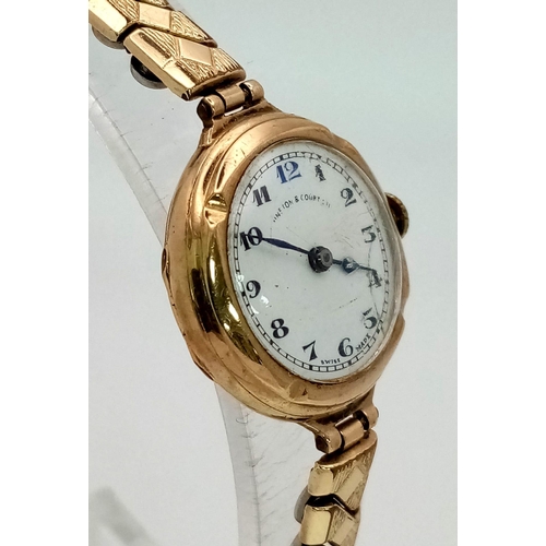 1217 - A Vintage Possibly Antique Johnston and Court Ltd 9K Gold Cased Ladies Watch. Expandable gold plated... 