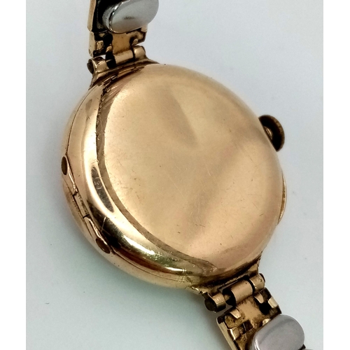 1217 - A Vintage Possibly Antique Johnston and Court Ltd 9K Gold Cased Ladies Watch. Expandable gold plated... 