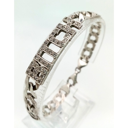 1386 - A 925 Silver Flat Curb Link Bracelet for a Female Dog. White stone decoration. 16cm. 13.75g.