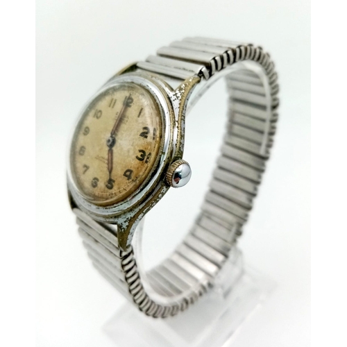 1440 - A Vintage Eloga 17 Jewel Gents Watch. Expandable stainless steel strap. Case - 33mm. Mechanical move... 