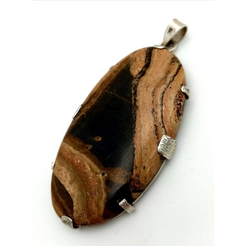 1483 - A Vintage-Style Large Tigers Eye Pendant set in Silver. 8cm.