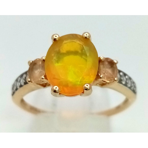 1489 - A 10K Yellow Gold Opal and Diamond Ring. Central oval opal with lemon quartz and small diamonds on w... 