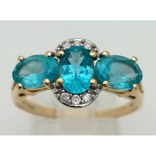 1492 - A 10K Yellow Gold Blue Three-Stone Tourmaline and Diamond Ring. Size R. Total weight - 2.68g.