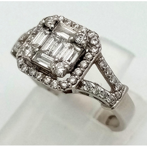 298 - An 18K White Gold Diamond Ring. A combination of baguette and round cut diamonds create the perfect ... 