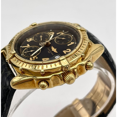 559 - AN 18K SOLID GOLD BREITLING CHRONOGRAPH WITH BLACK FACE AND GOLD NUMERALS, A FABULOUS LOOKING WATCH ... 