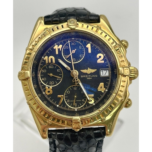 559 - AN 18K SOLID GOLD BREITLING CHRONOGRAPH WITH BLACK FACE AND GOLD NUMERALS, A FABULOUS LOOKING WATCH ... 