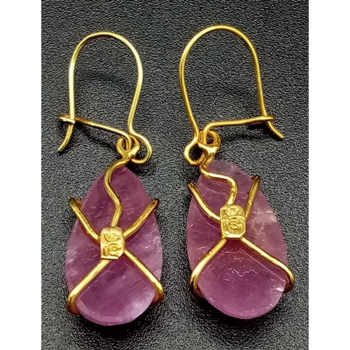 1249 - A Pair of 9K Gold and Ruby Teardrop Earrings. 2.58g total weight.