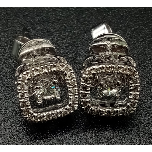 1255 - 9k White Gold Diamond Earrings. Total Weight 1.64grams.