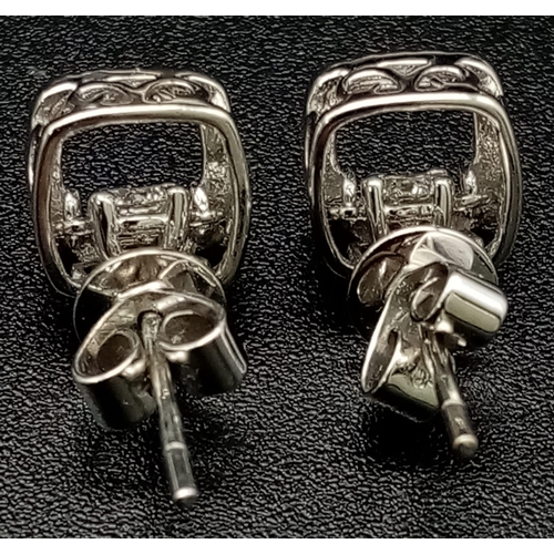 1255 - 9k White Gold Diamond Earrings. Total Weight 1.64grams.