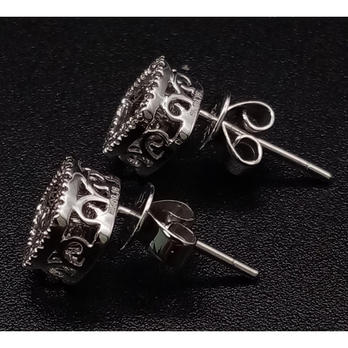 1255 - 9k White Gold Diamond Earrings. Total Weight 1.64grams.