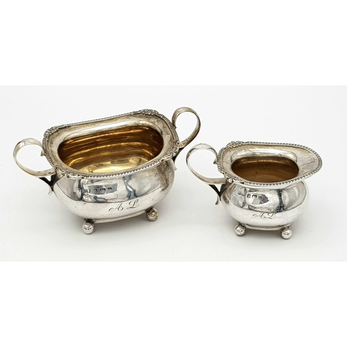 32 - A Henry Matthews Sterling Silver Four Piece Tea Set. To include Teapot, Coffeepot, Cream jug and Sug... 