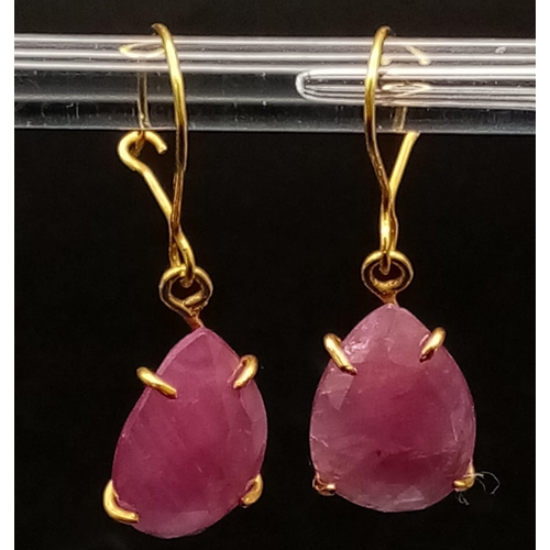 696 - A Pair of 9K Yellow Gold and Ruby Teardrop Earrings. 2.59g total weight.