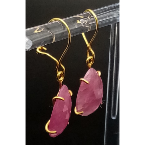 696 - A Pair of 9K Yellow Gold and Ruby Teardrop Earrings. 2.59g total weight.