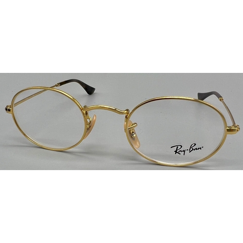 342 - A gold tone RAY-BAN pair of glasses with original case and cleaning cloth.