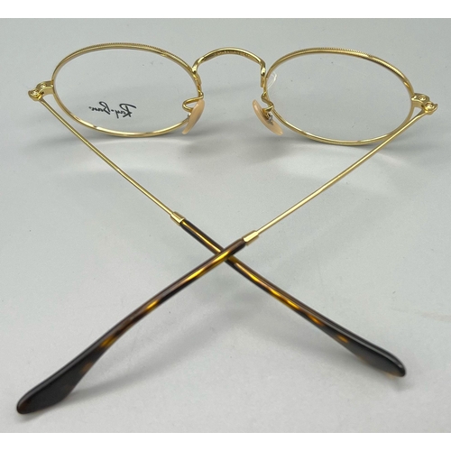 342 - A gold tone RAY-BAN pair of glasses with original case and cleaning cloth.