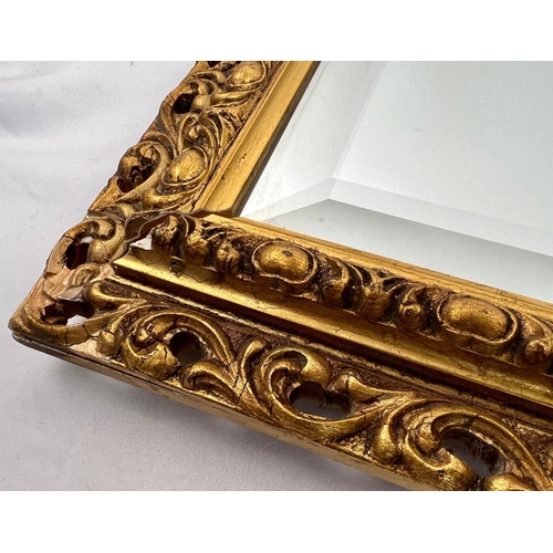 1223 - A Ornately Framed Mirror. 100cm x 54cm. a/f, please see photos for condition. Collection from Cadmor... 