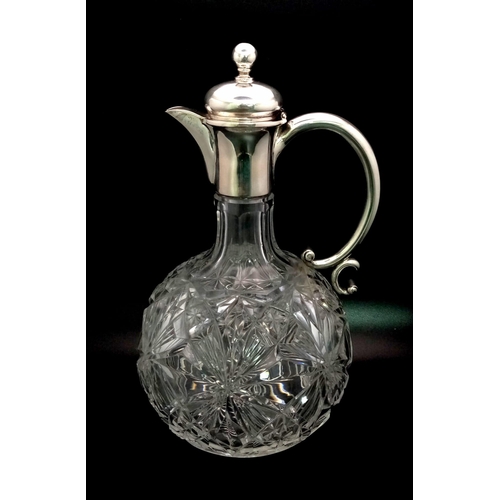 1349 - An Antique Cut-Glass and White Metal Claret Jug. 20cm tall.
Possibly interesting makers mark.