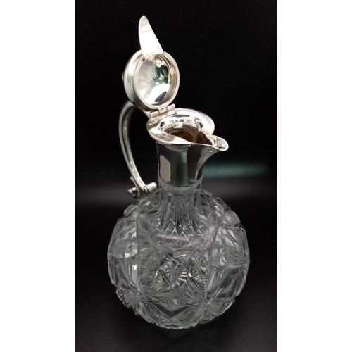 1349 - An Antique Cut-Glass and White Metal Claret Jug. 20cm tall.
Possibly interesting makers mark.