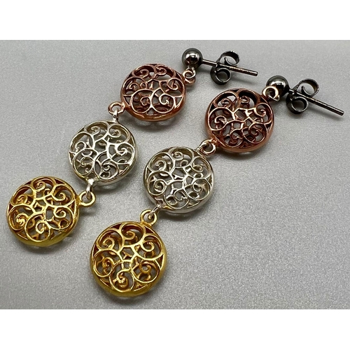 1377 - A Pair of Three Colour 925 Silver Dangler Earrings. White, Rose and Yellow pierced circular discs. 4... 