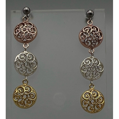 1377 - A Pair of Three Colour 925 Silver Dangler Earrings. White, Rose and Yellow pierced circular discs. 4... 