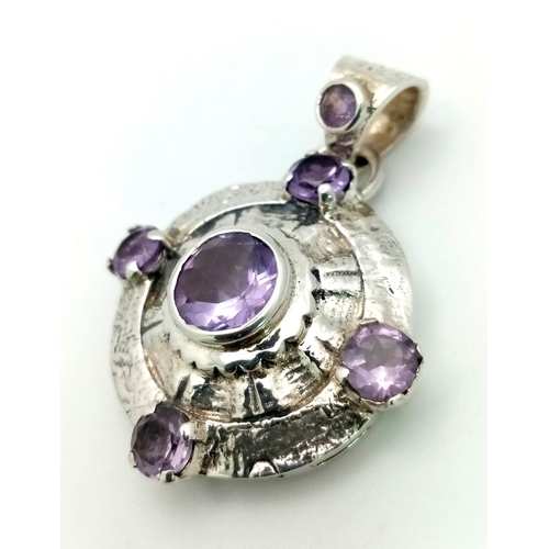 1448 - A 925 Silver Amethyst Circular Pendant. 5cm. 35mm diameter.