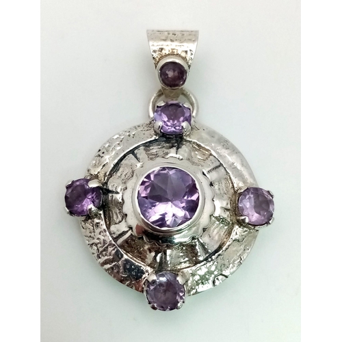 1448 - A 925 Silver Amethyst Circular Pendant. 5cm. 35mm diameter.