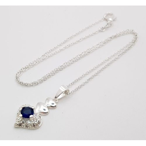 1344 - A 925 Silver Blue and White Stone Heart Pendant on a 925 Silver Disappearing Necklace. 3cm and 44cm