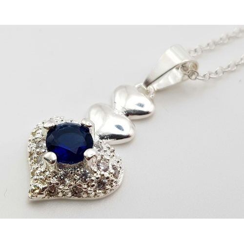 1344 - A 925 Silver Blue and White Stone Heart Pendant on a 925 Silver Disappearing Necklace. 3cm and 44cm