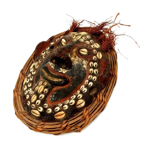 1091 - AN ANTIQUE PAPUA NEW GUINEA SEPIC RIVER TRIBAL MASK WITH TURTLE CARAPACE BASE.  22 X 18 APPROX.