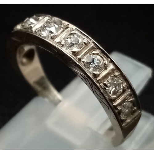 110 - A Vintage 18K White Gold Diamond Half-Eternity Ring. Nine diamonds. Size K 1/2. Total weight - 3.6g