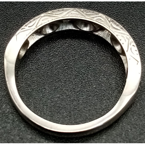 110 - A Vintage 18K White Gold Diamond Half-Eternity Ring. Nine diamonds. Size K 1/2. Total weight - 3.6g