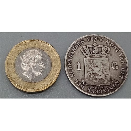 1149 - An 1848 Netherlands One Gulden Silver Coin. Please see photos for conditions.