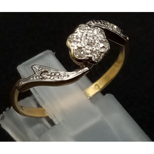 960 - An Edwardian 18K Gold and Platinum Floral-Twist Diamond Ring. Size P. 2.3g total weight.