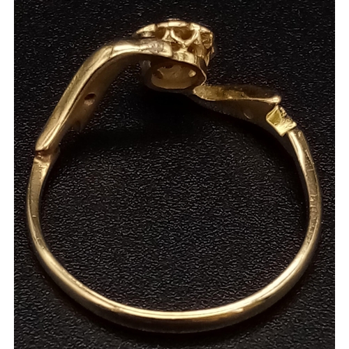 960 - An Edwardian 18K Gold and Platinum Floral-Twist Diamond Ring. Size P. 2.3g total weight.