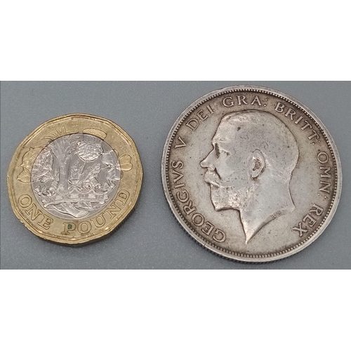 1142 - A 1918 George V Half Crown Silver Coin. Please see photos for conditions.