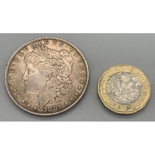 1163 - An 1881 USA Silver One Dollar Coin. Please see photos for conditions.