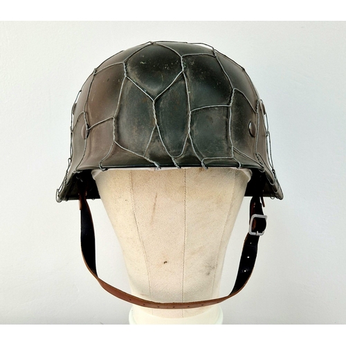 769 - Reproduction WW2 German M35 Helmet with D-Day Style Chicken Wire. A very nice copy. Ideal as a space... 