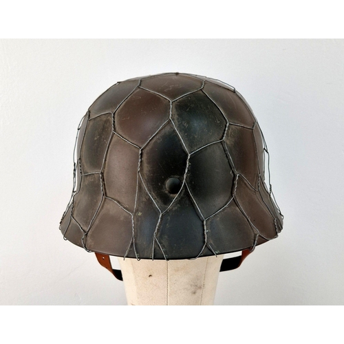 769 - Reproduction WW2 German M35 Helmet with D-Day Style Chicken Wire. A very nice copy. Ideal as a space... 